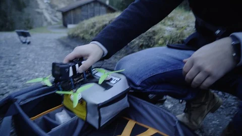 Man controls a drone through a remote control and glasses. Stock Footage 120935569