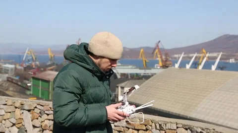 Man controls the flight of the aircraft through the remote control Stock Footage 62422947