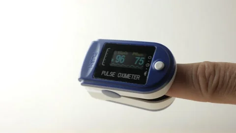 Man controls the oxygenation of the blood with the pulse Oximeter Stock Footage 157653602