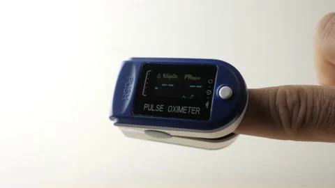 Man controls The Oxygenation of The Blood, Pulse Oximeter, COVID pandemic Stock Footage 157653651