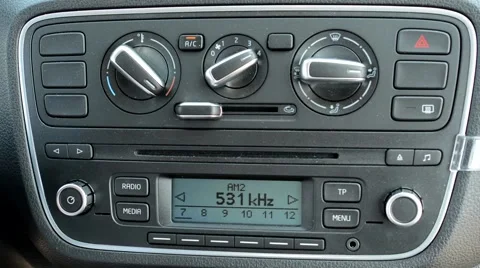 Man controls the panel of buttons of the modern car - maximum heating - detail Stock Footage 61516291