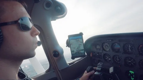 A man controls a plane at sunset. Stock Footage 125708548
