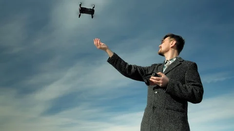 Man controls quadcopter outdoors Video stock 107041924