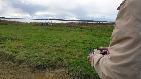 A man controls a quadrocopter. RC quadcopter. Stock-Footage 116485716