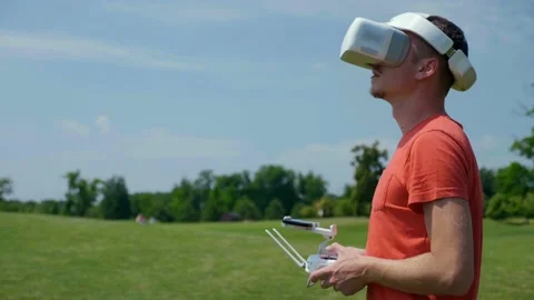 Man controls a quadrocopter through a remote control Stock Footage 131615147