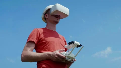 Man controls a quadrocopter through a remote control Stock Footage 131616197