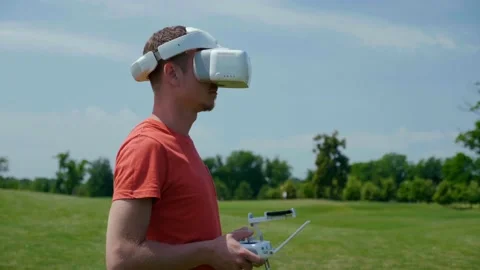 Man controls a quadrocopter through a remote control Stock Footage 132974630