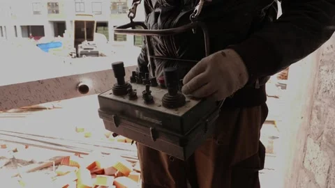 Man controls remote control at construction site Stock Footage 132495087