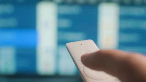 A man controls the remote control Stock Footage 306116157