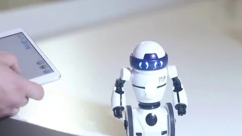 Man controls the robot Stock Footage 81786985