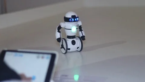 Man controls the robot using a tablet Stock Footage 81790262