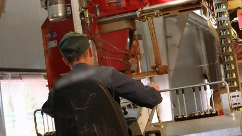 A man at the controls of a sawmill, a man controls a modern band saw Video stock 102913967