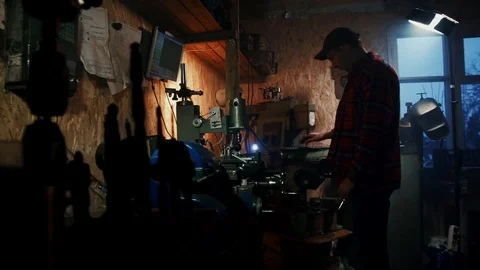 Man controls the work drilling CNC machinel in the workshop Stock Footage 84576681