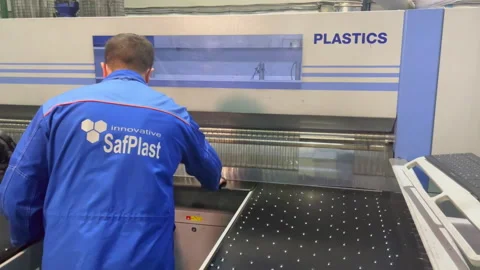 Man controls work of press machine at production plant Stock Footage 234318392