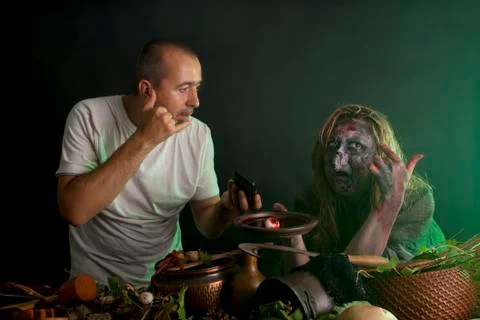 Man convinced witch of technology 库存照片