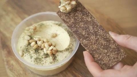 Man cook hands making toast with hummus 스톡 동영상 148900334