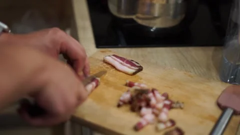 Man cook husband cutting slicing bacon italian pancetta pasta carbonara homemade Stock Footage 293248487
