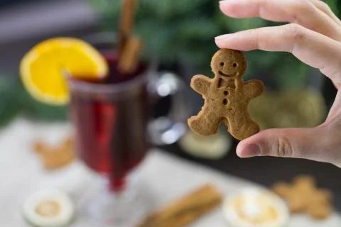 Man cookie, on the background of a mug with warm Christmas wine Stock Photos