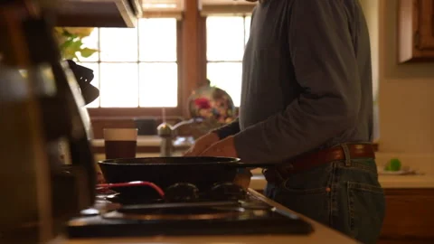 Man Cooking Breakfast, Cracking Eggs 库存影片 144357090