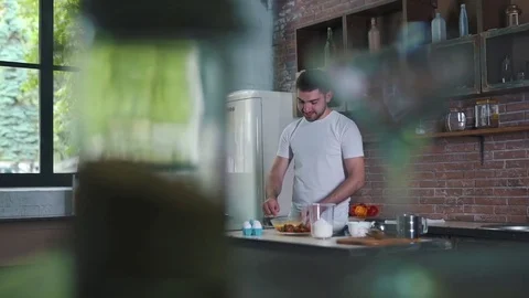 The man is cooking a breakfast Stock Footage 79108776
