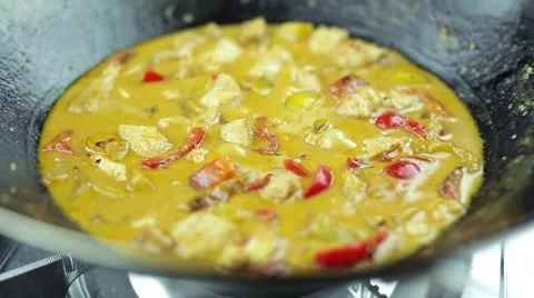 Man cooking chicken curry with vegetables on a wok pan 스톡 동영상 59755649