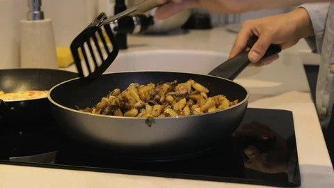 Man Cooking Dinner At Home Stock-Footage 130003728