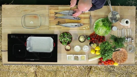 Man cooking fish top view Stock Footage 74456157