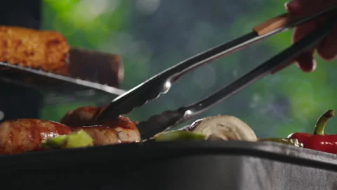 Man cooking on grill in garden Video stock 211761696