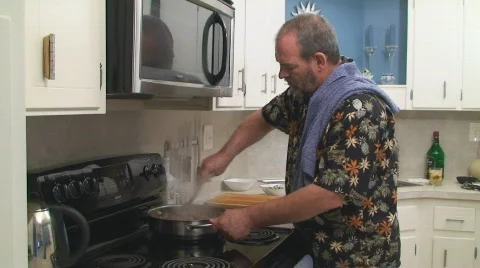 Man cooking at home Stock Footage 662795