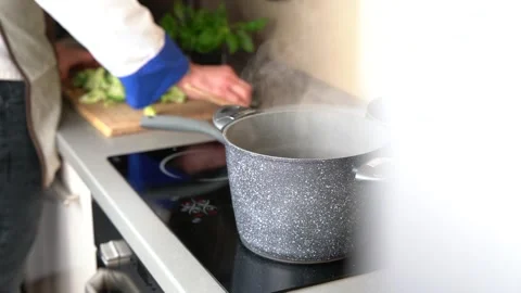 Man cooking in the home kitchen Stock Footage 161161912