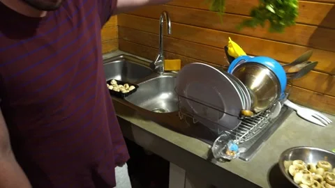 A man cooking in the kitchen in 4k Stock Footage 199500253