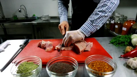 Man cooking meat in a clean kitchen Stock Footage 102585549