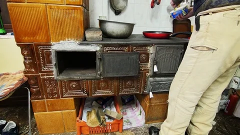 Man Cooking On An Old Fireplace Stock Footage 85077361