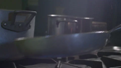 Man cooking onions in pan 스톡 동영상 233764244