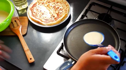 The man is cooking pancakes Stock Footage 67499214