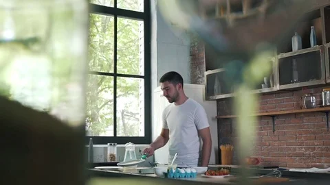 The man is cooking pancakes Stock Footage 79115908