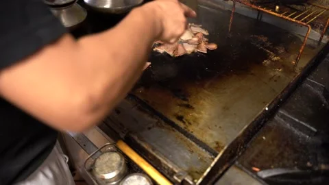 Man Cooking Pork Stock Footage 142724392