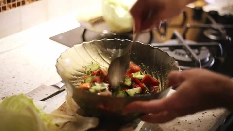 A man is cooking a salad Stock Footage 311023392