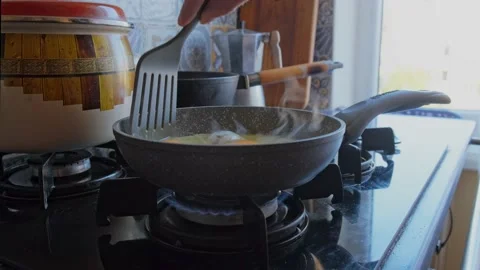 A man cooking scrambled eggs from a different angle Stock Footage 163992458