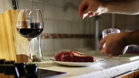 Man cooking steak at home Stock Footage 309292953