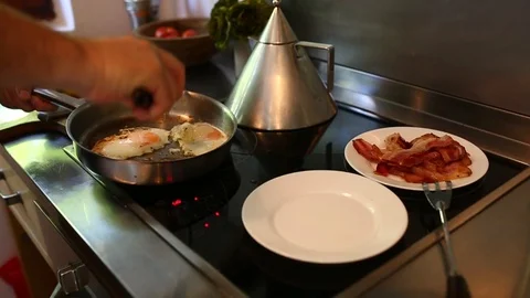 Man Cooking Sunny Side Up Eggs Video stock 97443219