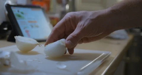 Man cooking with tablet slow motion Stock Footage 85892457