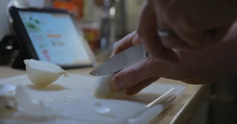 Man cooking with tablet slow motion Stock Footage 85892799