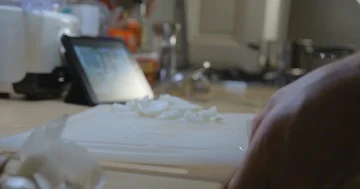 Man cooking with tablet slow motion Stockbeeldmateriaal 85893640