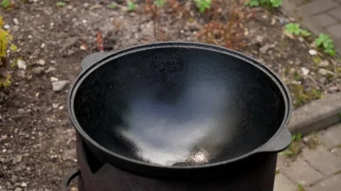 A man cooks fried meat in a pan with sauce and beer. 4K shooting Stock-Footage 131873586
