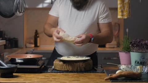 A man cooks at home Stock Footage 272754038