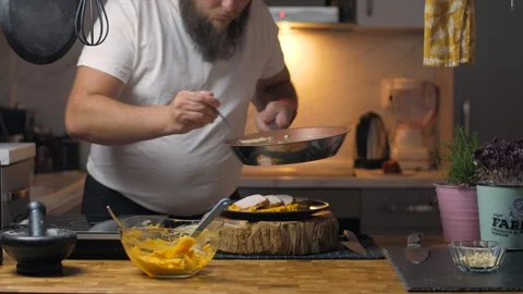 A man cooks at home Video stock 272754070