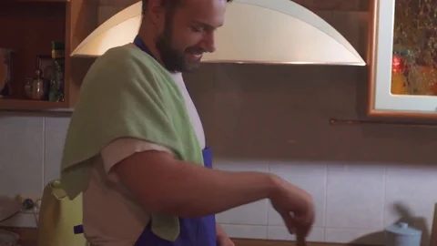 A man cooks in the kitchen Stock Footage 71641894