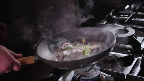 Man Cooks a Meal - adding fresh herbs - close up Stock Footage 151406642