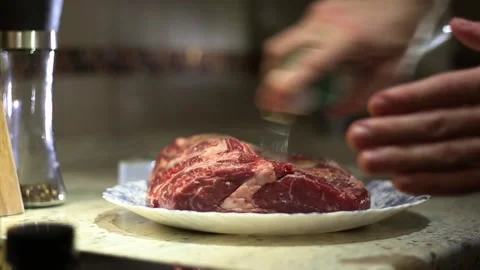 A man cooks a meat dinner Stock Footage 311023409